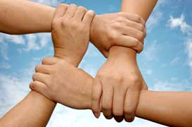 4 hands holding at wrists